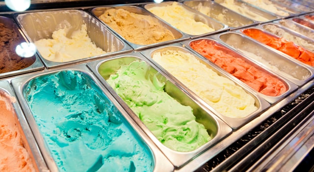 trays of ice cream behind serving counter