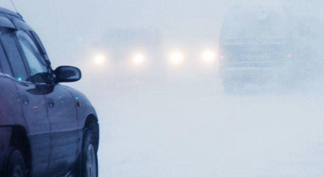 Car driving on snowy road