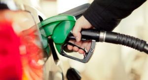 Closeup of gas pump in red car