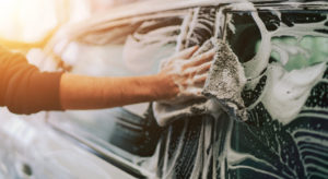 Hands washing car