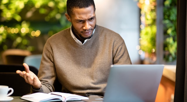 man looking at laptop