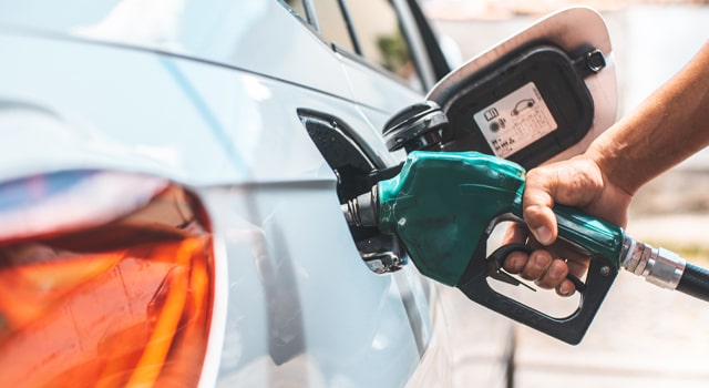 car at gas station getting gas