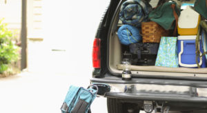 Back of SUV packed with camping gear