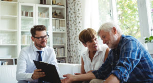 older couple finance prof laptop