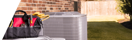 Tools sitting on top of AC condenser unit