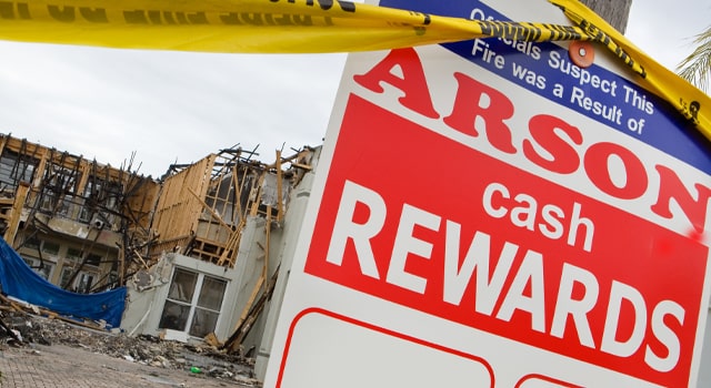 Sign reading Arson cash Reward