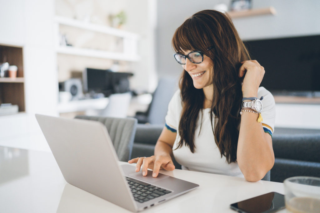 Woman on laptop figuring out what to know about home insurance