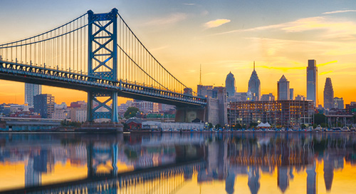 Bridge and skyline reflecting on the water