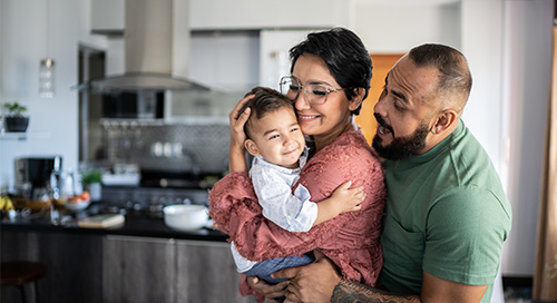 Mother and father holding their baby