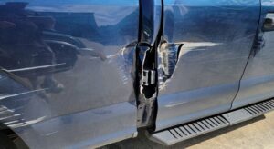 Damaged truck awaits repairs after car insurance deductible was paid