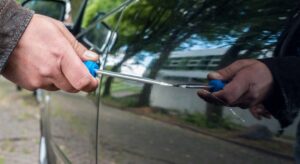 Person committing vandalism on a car covered by insurance.