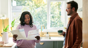 Couple in kitchen discussing home quotes