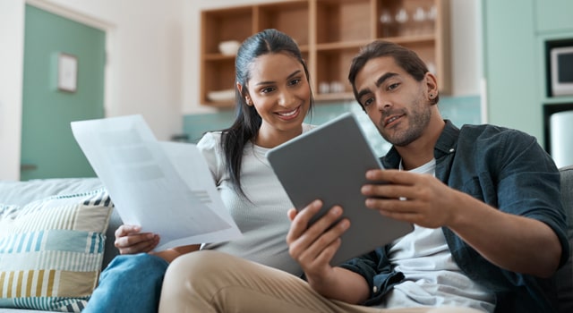 Young couple reviewing car insurance documents
