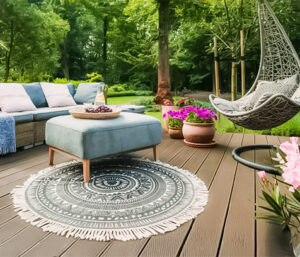 Deck with furniture and backyard full of flowering plants and trees
