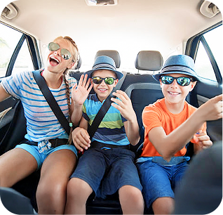 three young children seat belted in back seat of an suv