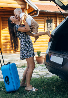 young mom with child near suv